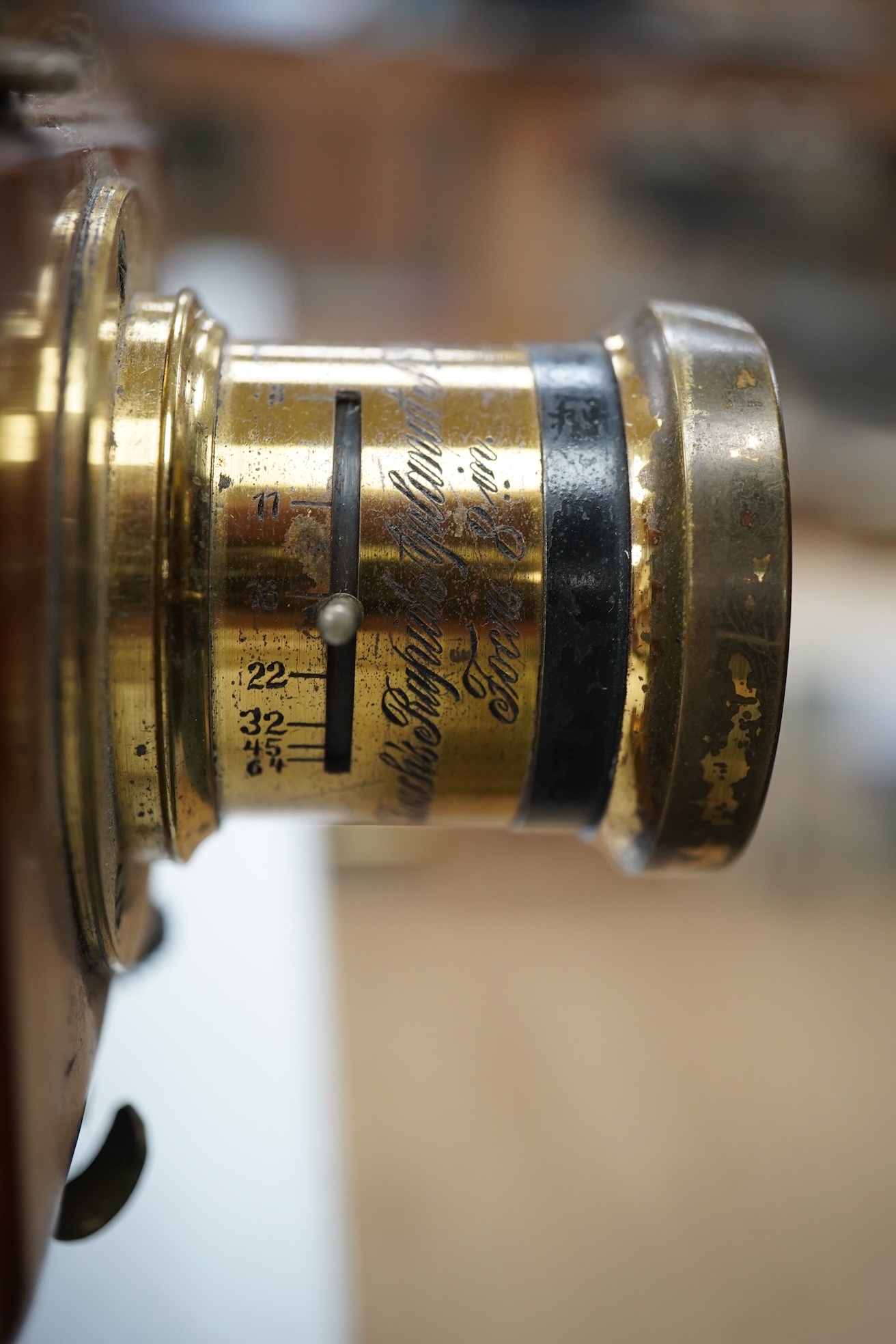 A late 19th/early 20th century brass and mahogany half plate bellows camera with a lens and a shutter action by Thornton Pickard. Condition - glass missing